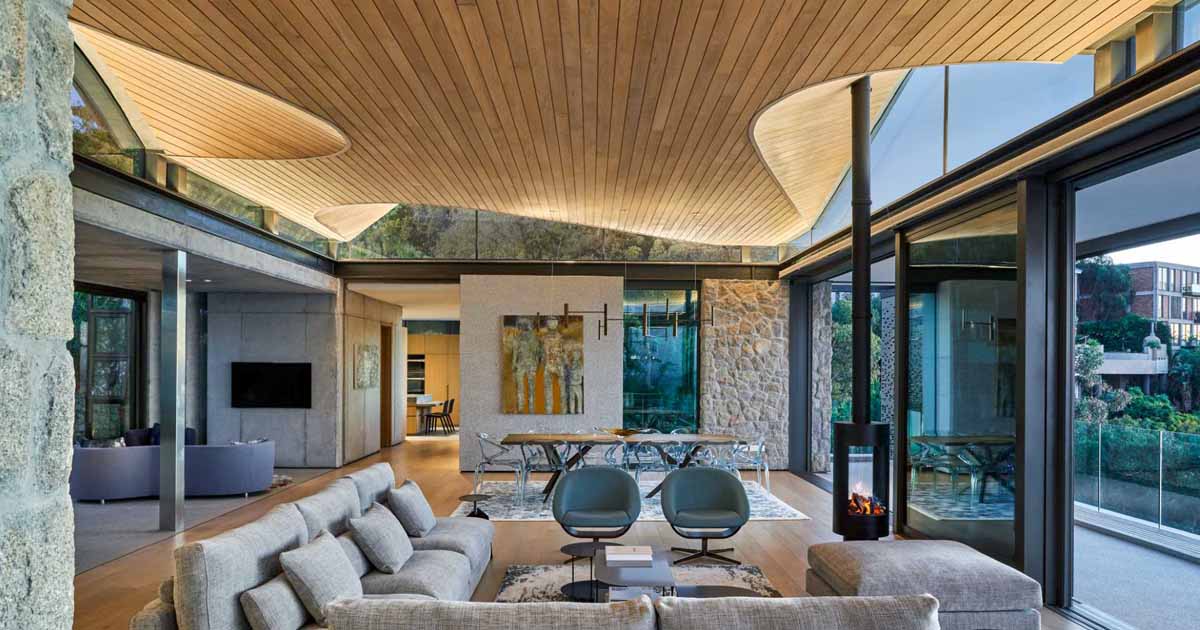 An Undulating Wood Ceiling Impressed By Ocean Waves And Shut by Mountains