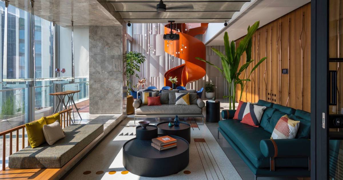 An Orange Spiral Staircase Is An Eye-Catching Operate Inside This Rental